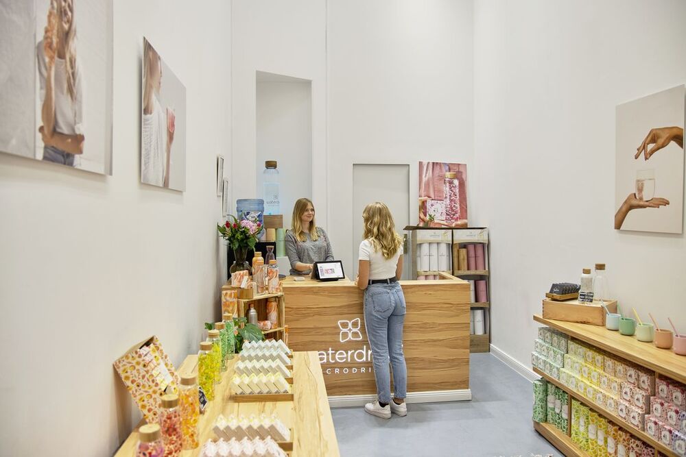 Shop assistant serving a customer at the counter
